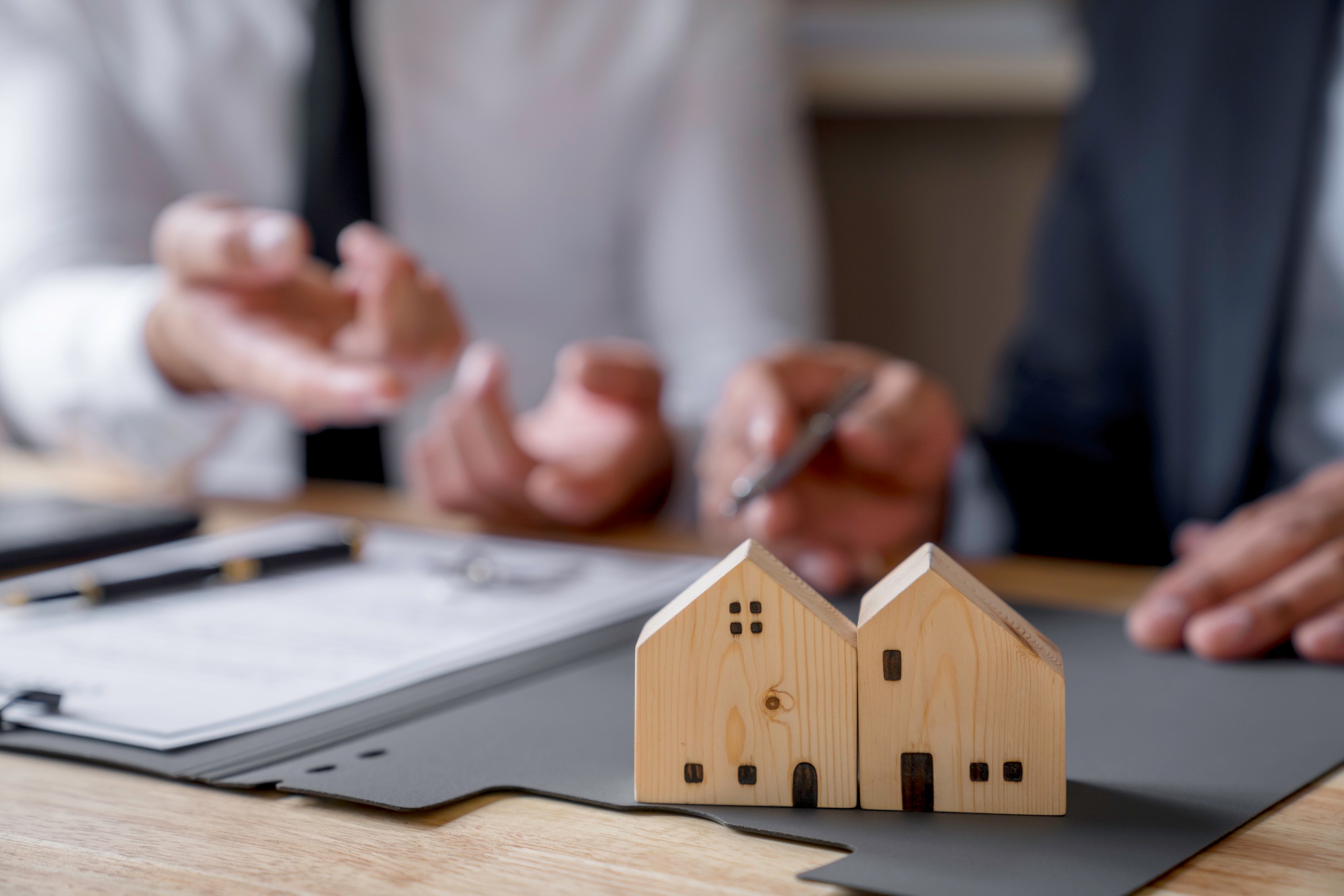 Discussion With A Real Estate Agent, a businesswoman signing a contract for Insurance protecting hou